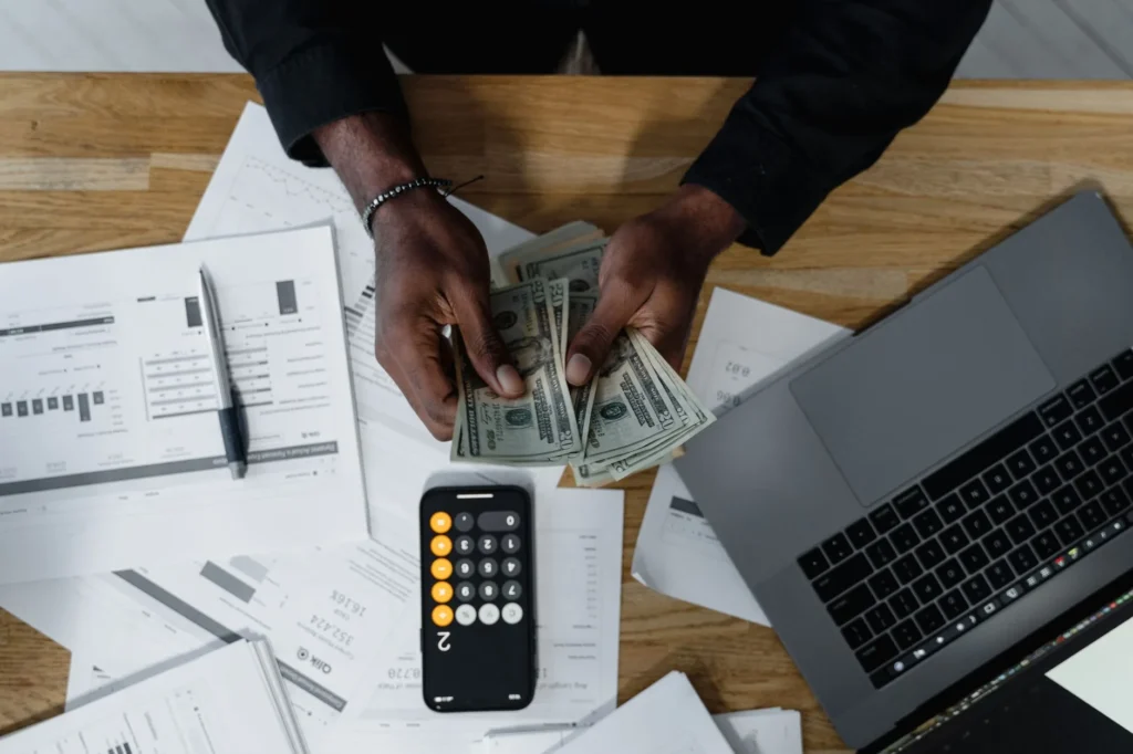 IT professional reviewing certification salary data on laptop