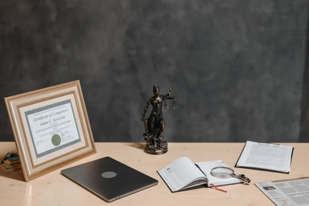 CompTIA certification exam vouchers and study materials on a desk