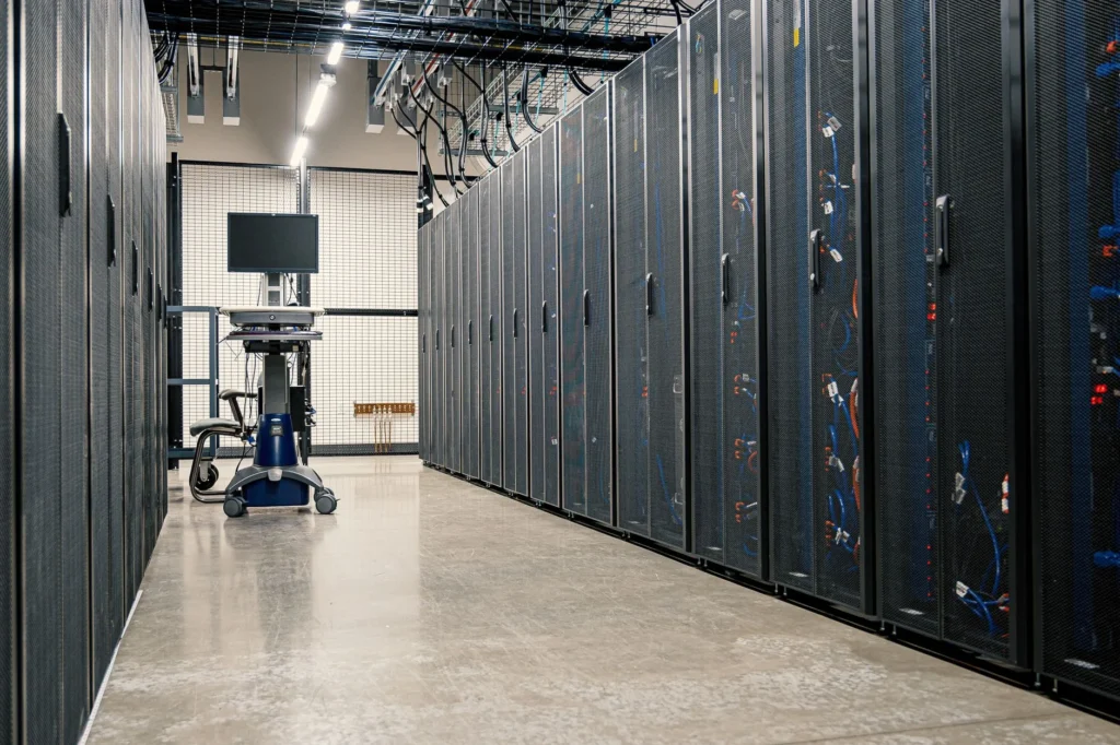 Rows of illuminated server racks inside a secure cloud data center.