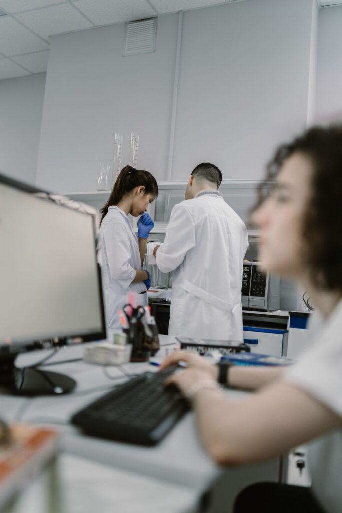 Scientist working at computer in laboratory