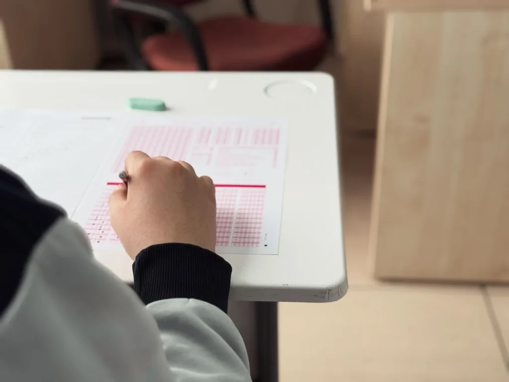 IT professional working through a cloud certification practice exam at a desk