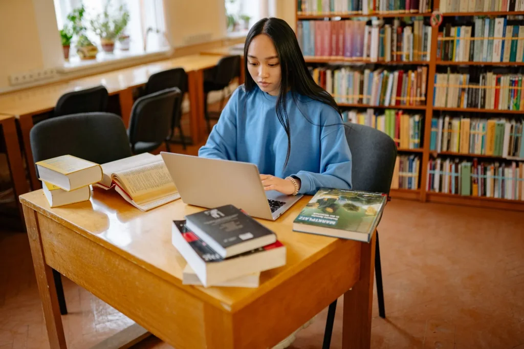 Candidate reviewing networking notes and practice questions while preparing for an IT certification exam