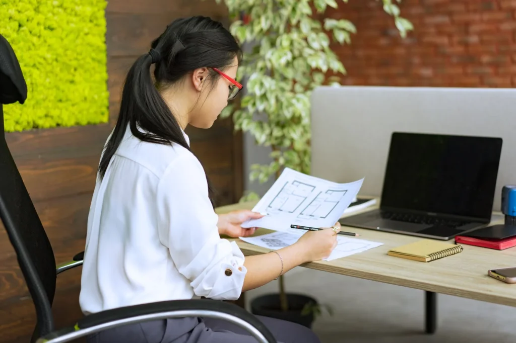 Study plan covering official AWS, Microsoft, Cisco, Fortinet and CompTIA certification exam paths on a desk beside a laptop and notebook.