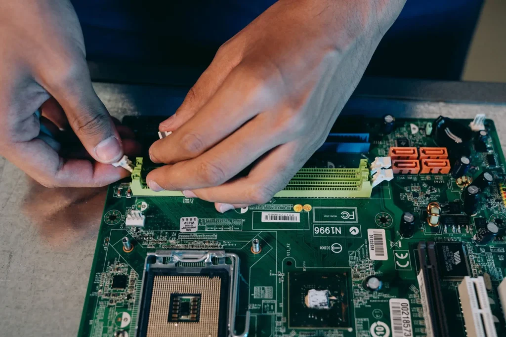 An IT support technician diagnosing hardware issues on a desktop computer, representing CompTIA A+ skills.